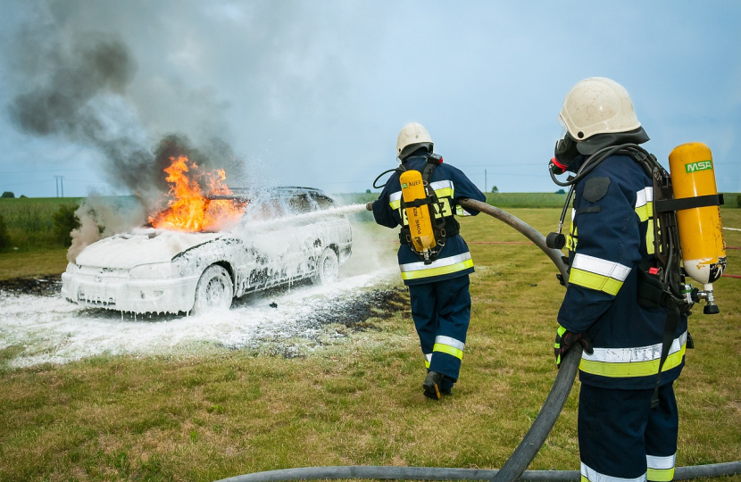 Firefighters putting out a car fire. Image by Włodek from Pixabay