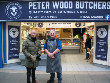 Altaf and Peter Wood outside his butchers shop