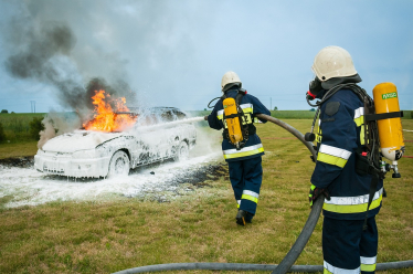 Firefighters putting out a car fire. Image by Włodek from Pixabay